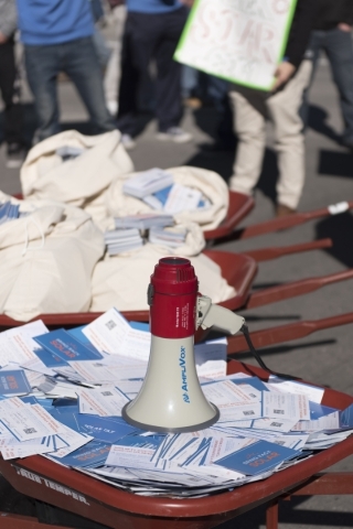 Three wheelbarrows filled with the approximately 30,000 signatures of people who support restoring old rooftop solar rates are seen as solar workers and supporters protest outside of the Public Ut ...