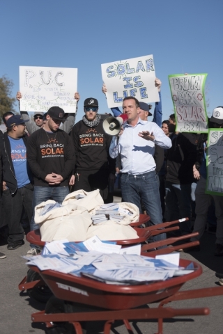 SolarCity Senior Vice President Marco Krapels, center, speaks to solar workers and supporters protesting outside of the Public Utilities Commission office at 9075 W. Diablo Dr. in Las Vegas Monday ...