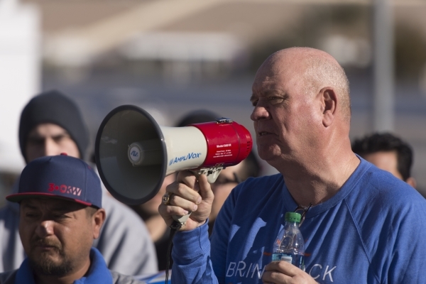 SolarCity warehouse worker Mike Collian, right, speaks to solar workers and supporters protesting outside of the Public Utilities Commission office at 9075 W. Diablo Dr. in Las Vegas Monday, Feb.  ...
