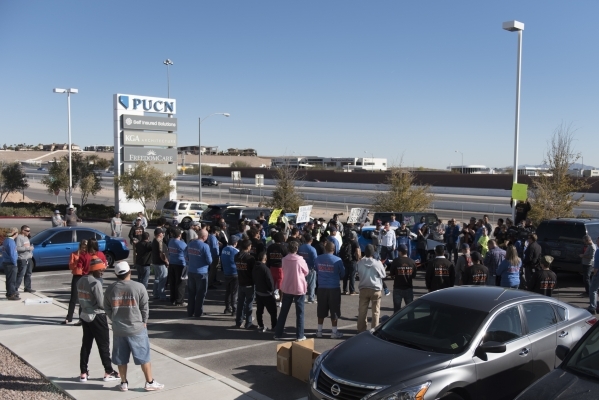 Solar workers and supporters protest outside of the Public Utilities Commission office at 9075 W. Diablo Dr. in Las Vegas Monday, Feb. 8, 2016. The protesters brought three wheelbarrows filled wit ...