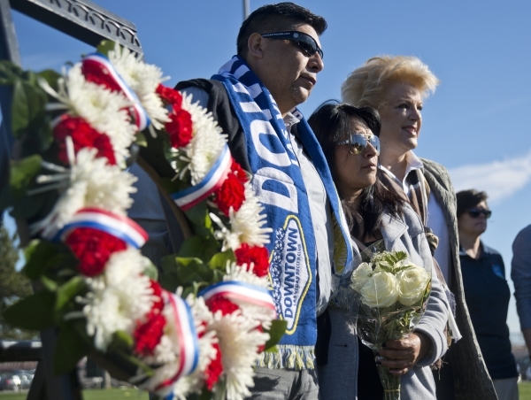 Jose Hernandez, left, and Beatrice Gonzalez, the parents of Nohemi Gonzalez, a college student killed in the recent terrorist attacks in Paris, stand with Las Vegas Mayor Carolyn Goodman during op ...