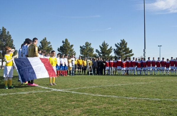 The Sagebrush Soccer Club United Red 98 from Reno, right, and Team LA 59-62 from France stand during opening ceremonies for the Las Vegas MayorÃ¾ÃÃ´s Cup International Showcase at the Betty ...