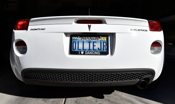 The license plate of Oliver Phillips‘ sports car is displayed at his Henderson home Tuesday, Feb. 9, 2016. Phillips, 85, died in January from injuries from a beating in his home by a paid es ...