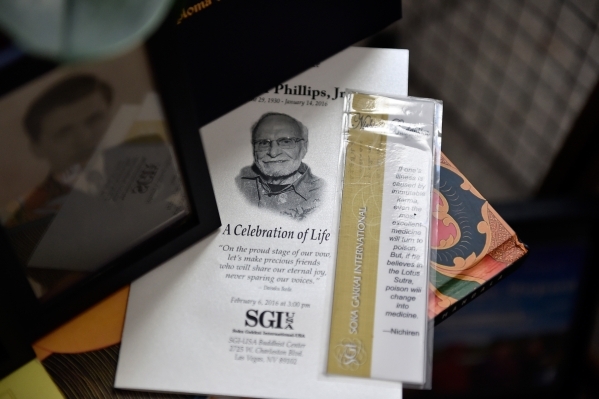 A memorial card is displayed in the Henderson home of Oliver Phillips Tuesday, Feb. 9, 2016. Phillips, 85, died in January from injuries from a beating in his home by a paid escort. David Becker/L ...