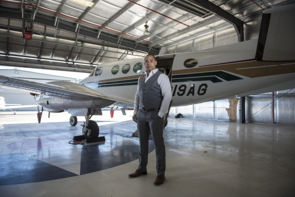 Quick Jet Charter Founder/CEO George Moore III poses for a portrait next to his King Air 90 twin engine turbo prop plane at the North Las Vegas Airport on Monday, Feb. 15, 2016. Martin S. Fuentes/ ...