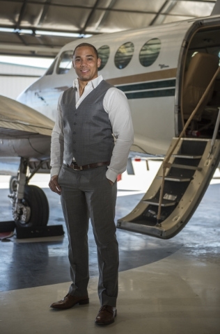 Quick Jet Charter Founder/CEO George Moore III poses for a portrait next to his King Air 90 twin engine turbo prop plane at the North Las Vegas Airport on Monday, Feb. 15, 2016. Martin S. Fuentes/ ...