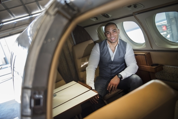 Quick Jet Charter Founder/CEO George Moore III poses for a portrait inside his King Air 90 twin engine turbo prop plane at the North Las Vegas Airport on Monday, Feb. 15, 2016. Martin S. Fuentes/L ...