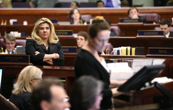 Nevada Assemblywoman Michele Fiore, R-Las Vegas, watches the final chaotic minutes of the session tick down at the Legislative Building in Carson City, Nev., on Monday, June 1, 2015. (Cathleen All ...
