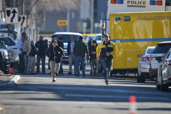 Police run down Dumont Boulevard during a barricade situation in Las Vegas on Friday, Feb. 12, 2016. A police dog named Nicky was stabbed during the apprehension of the suspect. Brett Le Blanc/Las ...