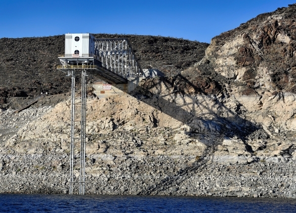 The Basic Management Inc. intake pipe is seen high above the water lever at Lake Mead on Tuesday, Jan. 12, 2016. As a long-term drought continues, a white "bathtub ring" on the rocks is  ...