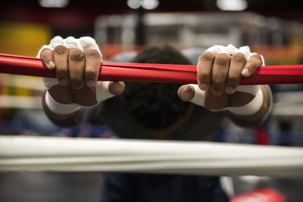 Professional boxer and former IBF welterweight champion "Showtime" Shawn Porter is seen stretching at his gym, the Porter Hy-Performance center, in Las Vegas on Thursday, Feb. 18, 2016. ...