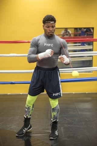 Professional boxer and former IBF welterweight champion "Showtime" Shawn Porter is seen punching a tennis ball for hand-eye coordination training at his gym, the Porter Hy-Performance ce ...