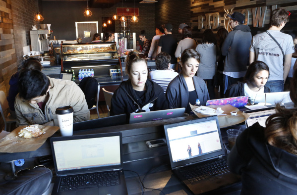 Customers work on their laptop inside Bad Owl Coffee on 10575 S. Eastern Ave., in Henderson Friday, Feb. 19, 2016. Bad Owl Coffee had its grand opening Feb. 13 and offers a Harry Potter-themed atm ...