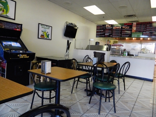 Free vintage arcade games and pizza by the slice are available at Gators Pizza, 1639 W. Warm Springs Road, where owner Alfredo Calderon wants to create a safe place for area youths to hang out. (C ...