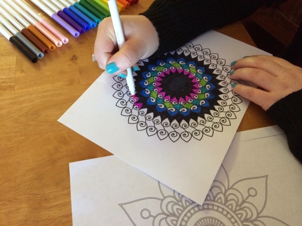 Adult coloring books like this one are one of the new ways people can help manage stress. The activity requires focused attention, much like medication, said Julie McIntosh, a licensed practical n ...