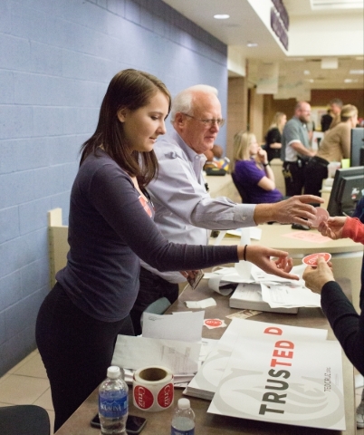 Skyla Wheeler, left, and Mark Howells take tickets and give out stickers and support signs to attendees before a rally for presidential candidate U.S. Sen. Ted Cruz, R-Texas, at Durango Hills Comm ...