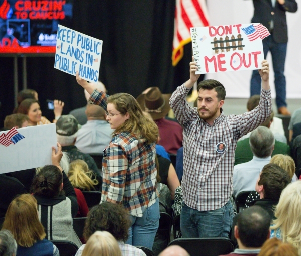 Hecklers with signs are removed during a rally for Republican presidential candidate U.S. Sen. Ted Cruz, R-Texas, at Durango Hills Community Center, 3521 N. Durango Dr., in Las Vegas Monday, Feb.  ...