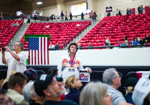 An Elvis impersonator looks on before Republican presidential candidate Donald Trump arrives to speak at a campaign rally at the Southpoint hotel-casino in Henderson on Monday, Feb. 22, 2016. Chas ...
