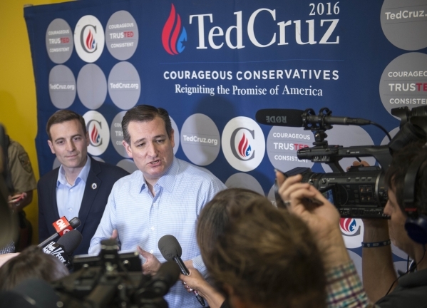 Nevada Attorney General Adam Laxalt, left, and Republican presidential candidate Sen. Ted Cruz of Texas speak with members of the news media before a rally at Draft Picks Sports Bar in Pahrump on  ...