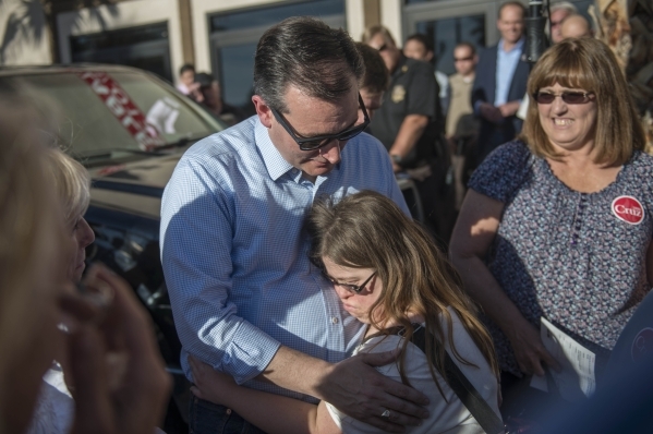 Republican presidential candidate Sen. Ted Cruz of Texas gets a hug from supporter Cinthia Nelson during a rally at Draft Picks Sports Bar in Pahrump on Sunday, Feb.  21, 2016. Nevada holds its Re ...