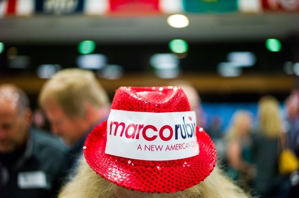 Carol Tanner, a supporter of Republican presidential candidate Marco Rubio shows off her hat as caucus-goers arrive at Bonanza High School in Las Vegas on Tuesday, Feb. 23, 2016. Chase Stevens/Las ...