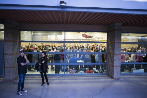 People stand outside of the Del Sol High School cafeteria where people participated in the Nevada Republican caucus on Tuesday, Feb. 23, 2016, in Las Vegas. Erik Verduzco/Las Vegas Review-Journal  ...