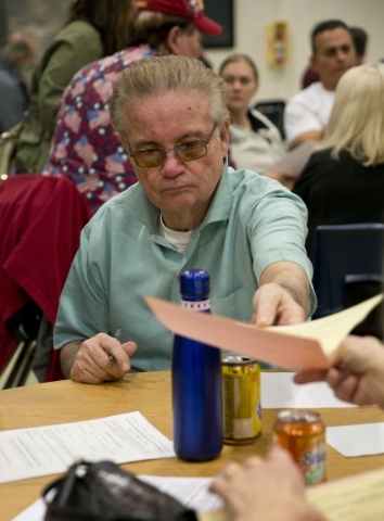 Bill Williams turns in paperwork to become a delegate inside Green Valley High School during the Nevada Republican presidential caucus in Henderson on Tuesday, Feb. 23. 2016. Daniel Clark/Las Vega ...