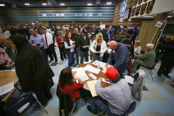 Caucus goers register with their precincts in the cafeteria of Centennial High School during the 2016 Republican caucus in Las Vegas on Tuesday, Feb. 23, 2016. Brett Le Blanc/Las Vegas Review-Jour ...