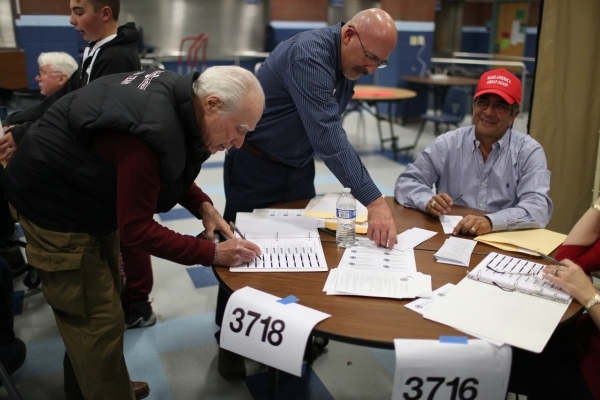 A caucus goer registers to vote in his precinct during the 2016 Republican caucus at Centennial High School in Las Vegas on Tuesday, Feb. 23, 2016. Brett Le Blanc/Las Vegas Review-Journal Follow @ ...
