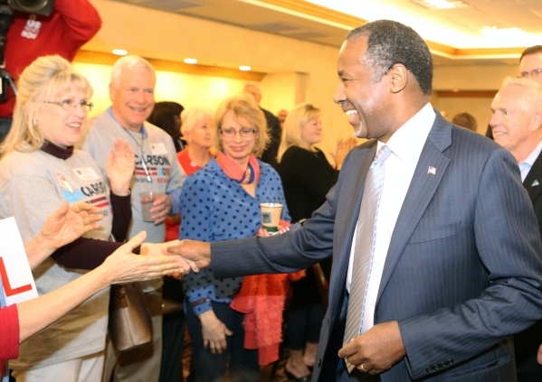 Republican presidential candidate Dr. Ben Carson shakes hands with supporters during the watch party at Embassy Suites Convention Center on Tuesday, Feb. 23, 2016, in Las Vegas. Bizuayehu Tesfaye/ ...
