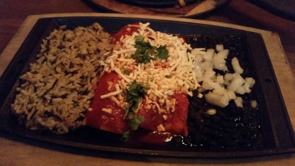 Vegan enchiladas with Cajun spiced tofu and vegan cheese, wild rice and black beans is shown at Nacho Daddy. Lisa Valentine/View