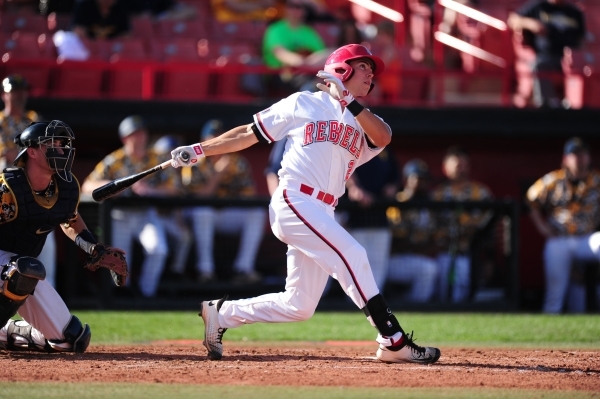 UNLV second baseman Justin Jones hits a solo home run against West Virginia in the fourth inning of their NCAA college Baseball game at Earl E. Wilson Stadium in Las Vegas Saturday, Feb. 27, 2016. ...
