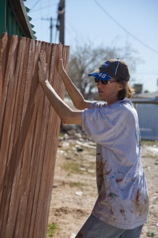 Krista Richardson repairs the fence around her home in a neighborhood that has seen a dramatic rise in poverty near Nellis and Las Vegas boulevards on Thursday, Feb. 25, 2016. Daniel Clark/Las Veg ...