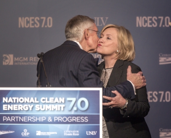 Then-Senate Majority Leader Harry Reid, left, and Hillary Clinton embrace during National Clean Energy Summit 7.0: Partnership & Progress on Sept. 4, 2014, at Mandalay Bay hotel-casino in Las ...