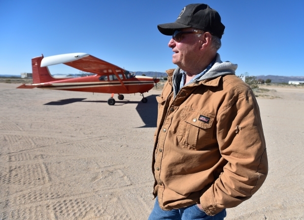 Dennis Layman stands by his single-engine Cessna plane as it is parked just outside the Cal-Nev-Ari Casino on Thursday, Feb. 25, 2016, in Cal-Nev-Ari. Layman flew from his home in Seligman, Ariz.  ...