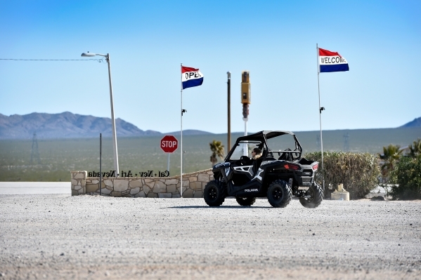 A resident travels along one of the dirt roads in her ATV Thursday, Feb. 25, 2016, in Cal-Nev-Ari. Airplanes and ATVs are the preferred modes of transportation throughout the small southern Clark ...