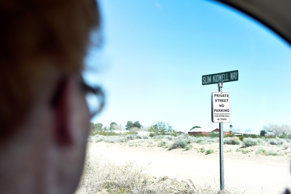 Town founder Nancy Kidwell drives by Slim Kidwell Way, a street named for her late husband Thursday, Feb. 25, 2016, in Cal-Nev-Ari. The two Kidwells acquired 640 acres of land under the federal Pi ...