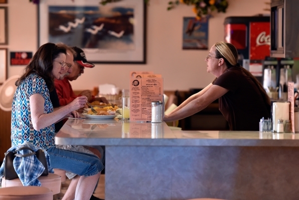 Waitress Jennifer Schumacher, right, tends to her customers at the Cal-Nev-Ari restaurant Thursday, Feb. 25, 2016, in Cal-Nev-Ari. Schumacher has been working for Nancy Kidwell off and on for the ...
