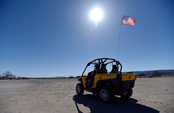 Jon Fowler travels along one of the dirt roads in his ATV on Thursday, Feb. 25, 2016, in Cal-Nev-Ari. Airplanes and ATVs are the preferred modes of transportation throughout the small southern Cla ...