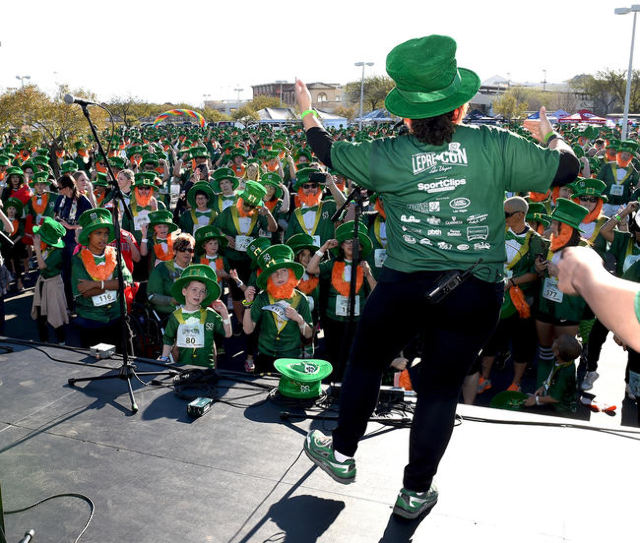 Kathleen Ruddy President of St. Baldrick‘s Foundation for Childhood Cancer Research and her dancing leprecauhn attempt to teach the hundreds of runners who came out for their 5k run an Irish ...