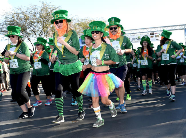 St. Baldrick‘s Foundation for Childhood Cancer Research 5k Run leaves the starting line as they attempt to break the record for the largest gathering of leprechauns at Town Square in Las Veg ...