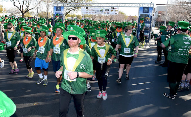 St. Baldrick‘s Foundation for Childhood Cancer Research 5k Run leaves the starting line as they attempt to break the record for the largest gathering of leprechauns at Town Square in Las Veg ...