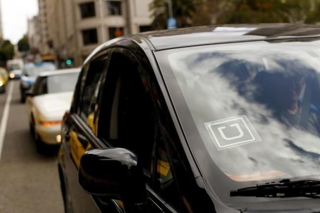 The Uber logo is seen on a vehicle near Union Square in San Francisco, California May 7, 2015. (Robert Galbraith/Reuters)