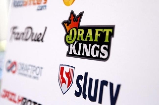 A DraftKings logo is displayed on a board inside of the DFS Players Conference in New York, Nov. 13, 2015. (Lucas Jackson/Reuters)