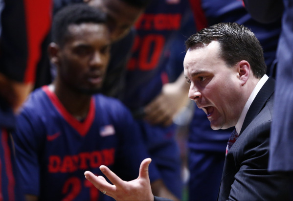 Feb 12, 2016; Kingston, RI, USA; Dayton Flyers head coach Archie Miller (R) speaks to his team during the second half of a game against the Rhode Island Rams at Thomas M. Ryan Center. Mandatory Cr ...