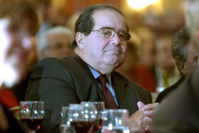 U.S. Supreme Court Justice Antonin Scalia sits in the audience at a National Italian American Foundation event in Washington, in this file photo taken October 20, 2006. (Reuters/Jonathan Ernst/Files)