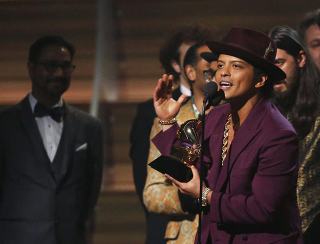 Singer Bruno Mars accepts the Best Record of the Year award. REUTERS/Mario Anzuoni