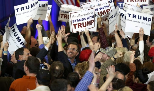 Supporters of Donald Trump celebrate as Trump is projected by television networks as the winner of the South Carolina primary, at his primary night rally in Spartanburg, South Carolina February 20 ...