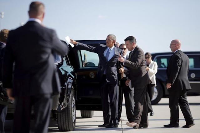 President Obama talks to Nevada Governor Brian Sandoval as he arrives at McCarran International Airport in Las Vegas, August 24, 2015. (Carlos Barria/Reuters)