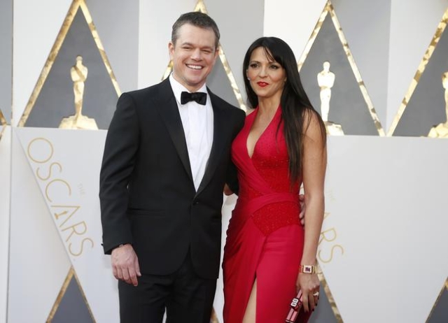 Matt Damon, nominated for Best Actor for his role in "The Martian," arrives with his wife Luciana Barroso at the 88th Academy Awards in Hollywood, California February 28, 2016. REUTERS/ ...
